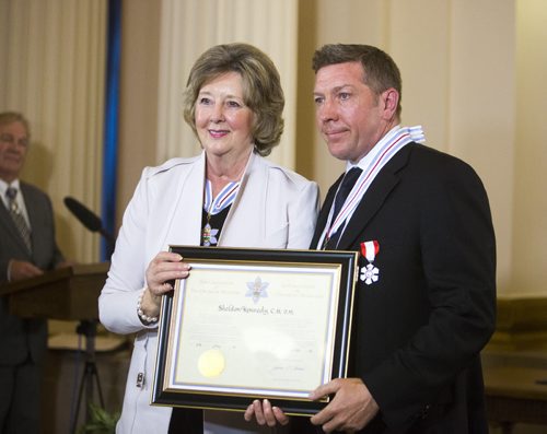 Sheldon Kennedy gets awarded the Order of Manitoba at the Manitoba Legislative Building in Winnipeg on Thursday, July 9, 2015.   Mikaela MacKenzie / Winnipeg Free Press