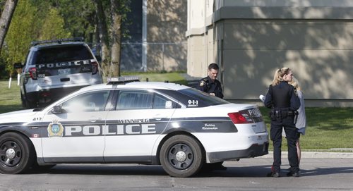 Winnipeg Police outside one of the complexes in the St.Vital Villa 200 Beliveau Rd. Friday morning after police responded to report of someone with gun. A person was taken into custody. No injuries. Wayne Glowacki / Winnipeg Free Press July 10 2015 ¤