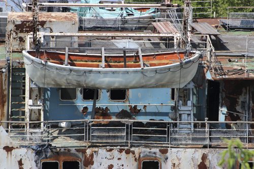 Conservation Minister Tom Nevakshonoff, Finance Minister Greg Dewar, and Selkirk Mayor Larry Johannson announced demolition and clean-up of the MS Lord Selkirk, in the background. BILL REDEKOP?WINNIPEG FREE PRESS July 10, 2015  017 - Lifeboat on the MS Lord Selkirk