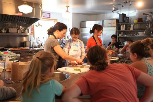 Sunday This city piece on the Food Studio, Maria Abiuis (orange shirt), owner of The Food Studio hosts cooking camps during the summer for kids & teens with the help of her sister Angela Houldsworth (grey shirt). See Dave Sanderson story.  July 09, 2015 Ruth Bonneville / Winnipeg Free Press