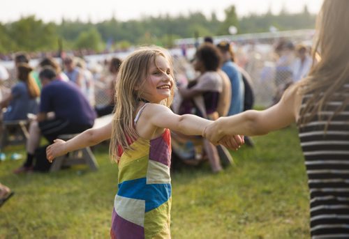 Arielle Derksen, 8, plays with her sister at the Winnipeg Folk Festival in Birds Hill Park on Friday, July 10, 2015.   Mikaela MacKenzie / Winnipeg Free Press