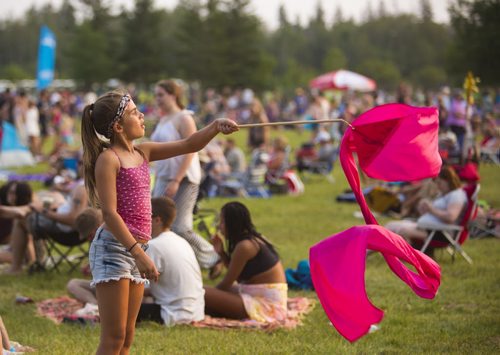 Alexia Candeias twirls a ribbon at the Winnipeg Folk Festival in Birds Hill Park on Friday, July 10, 2015.   Mikaela MacKenzie / Winnipeg Free Press