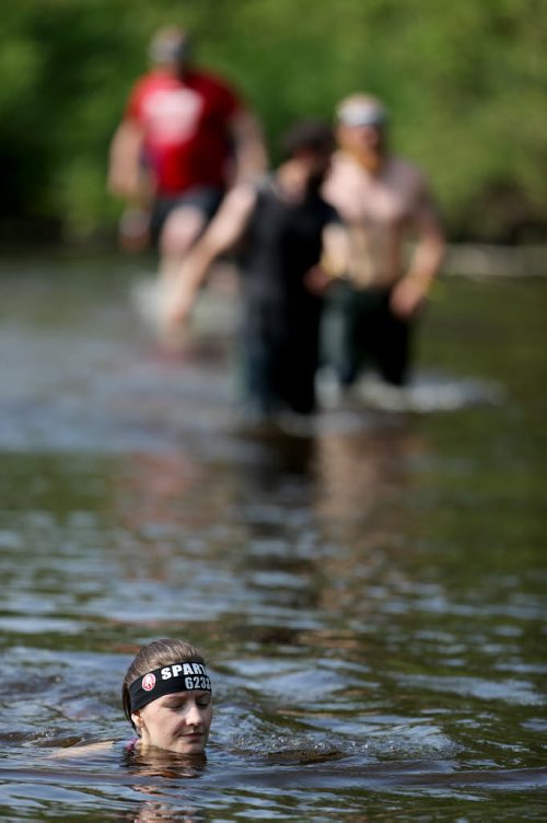 Competitors at the Spartan Race, a 5km obstacle course in Grunthal, Saturday, July 11, 2015. (TREVOR HAGAN/WINNIPEG FREE PRESS)