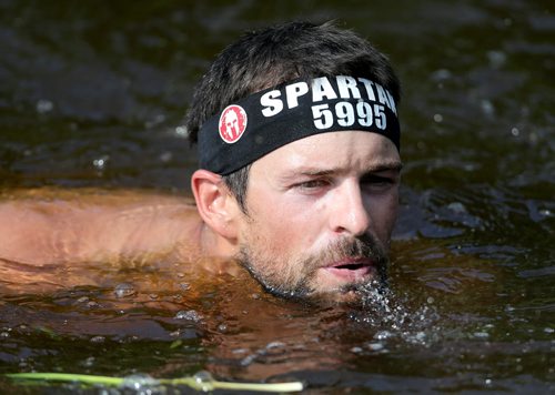 Competitors at the Spartan Race, a 5km obstacle course in Grunthal, Saturday, July 11, 2015. (TREVOR HAGAN/WINNIPEG FREE PRESS)