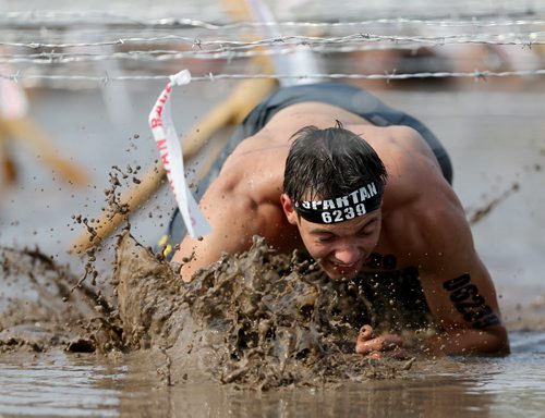 Competitors at the Spartan Race, a 5km obstacle course in Grunthal, Saturday, July 11, 2015. (TREVOR HAGAN/WINNIPEG FREE PRESS)