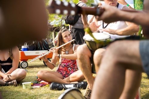 Liat Paradise plays flute in a jam circle at the Winnipeg Folk Festival at Birds Hill Provincial Park on Saturday, July 11, 2015.   Mikaela MacKenzie / Winnipeg Free Press
