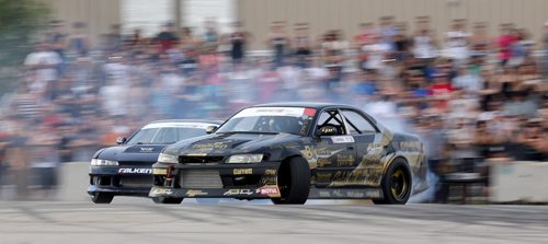 Brad Carlton, from Mississauga, Ontario, and Mats Baribeau, from Brockville, Ontario, drifting during a Formula D Canada drifting demo at the Red River Ex Grounds during Driven, a car show, Saturday, July 11, 2015. (TREVOR HAGAN/WINNIPEG FREE PRESS)