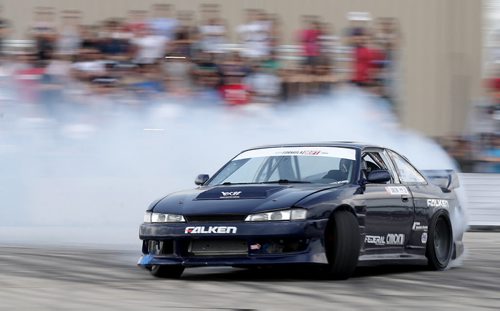 Brad Carlton, from Mississauga, Ontario, drifting during a Formula D Canada drifting demo at the Red River Ex Grounds during Driven, a car show, Saturday, July 11, 2015. (TREVOR HAGAN/WINNIPEG FREE PRESS)