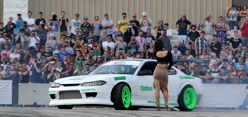 Chris Gonzalez, from Winnipeg, drifting circles around a woman, during a Formula D Canada drifting demo at the Red River Ex Grounds during Driven, a car show, Saturday, July 11, 2015. (TREVOR HAGAN/WINNIPEG FREE PRESS)