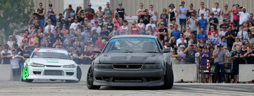 Chris Gonzalez, left, from Winnipeg, and Matt Murphy, from Fort McMurray, Alberta, drifting during a Formula D Canada demo at the Red River Ex Grounds during Driven, a car show, Saturday, July 11, 2015. (TREVOR HAGAN/WINNIPEG FREE PRESS)