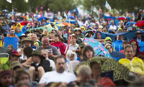 People enjoy the Winnipeg Folk Festival despite a bit of rain at Birds Hill Provincial Park on Saturday, July 11, 2015.   Mikaela MacKenzie / Winnipeg Free Press