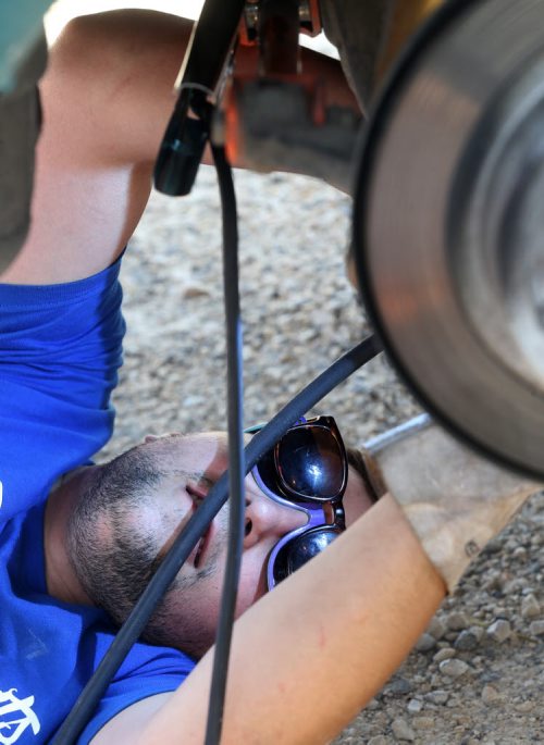 Dyllan Angelkovski, welding one of the Formula D Canada cars at Driven 2015, a car show at the Red River Exhibition Grounds, Saturday, July 11, 2015. (TREVOR HAGAN/WINNIPEG FREE PRESS)