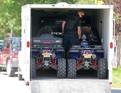 Winnipeg Police unload ATV's to use while searhing for Thelma Krull in East Kildonan, Sunday, July 12, 2015. (TREVOR HAGAN/WINNIPEG FREE PRESS)