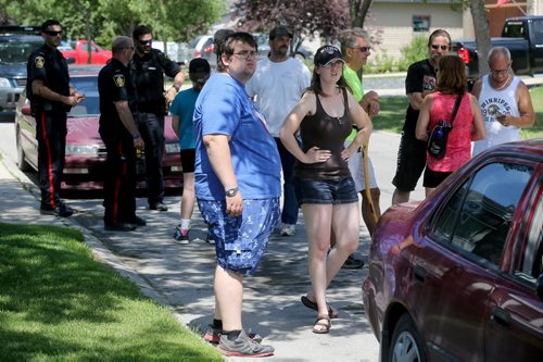 Friends and neighbours organize together to help search for Thelma Krull in East Kildonan, Sunday, July 12, 2015. (TREVOR HAGAN/WINNIPEG FREE PRESS)