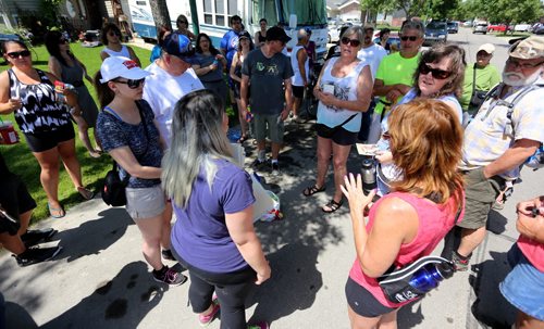 Friends and neighbours organize together to help search for Thelma Krull in East Kildonan, Sunday, July 12, 2015. (TREVOR HAGAN/WINNIPEG FREE PRESS)