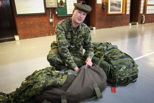 Brian Trenchard a reservist with the Queen's Own Cameron Highlanders gets ready at Minto Armoury packing up equipment for the nine hour trip to Prince Albert, Saskatchewan. Approximately 35 Canadian Forces reservists from 38 Canadian Brigade Group shipped off to Prince Albert, Sask. Monday, where they will receive a one-day crash course in firefighting before tackling the real thing on the ground. 150713 - Monday, July 13, 2015 -  MIKE DEAL / WINNIPEG FREE PRESS
