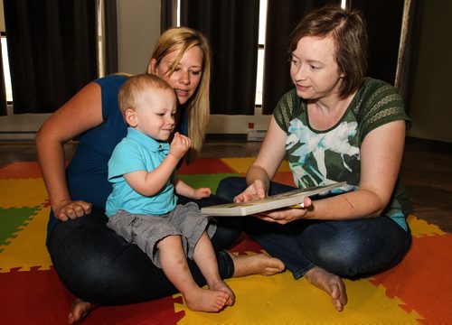 Serena Yong (right) reads with toddler Colton Olenick, 21 months, and his mother Nicole Hacault. Serena runs Little Signing Stars, a baby and toddler sign language course. Serena has published two books to help parents teach their kids sign language. 150713 - Monday, July 13, 2015 -  MIKE DEAL / WINNIPEG FREE PRESS