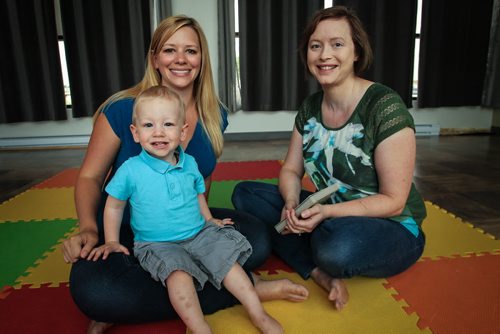 Serena Yong (right) reads with toddler Colton Olenick, 21 months, and his mother Nicole Hacault. Serena runs Little Signing Stars, a baby and toddler sign language course. Serena has published two books to help parents teach their kids sign language. 150713 - Monday, July 13, 2015 -  MIKE DEAL / WINNIPEG FREE PRESS