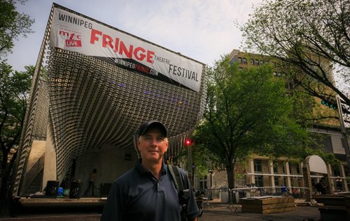 Chuck McEwen, executive producer of the Winnipeg Fringe Festival, at the Old Market Square stage as setup swirls around him is relaxed, but ready for the opening of the festival on Wednesday.  For Kevin Prokosh ENT. story  July 14, 2015 - MELISSA TAIT / WINNIPEG FREE PRESS