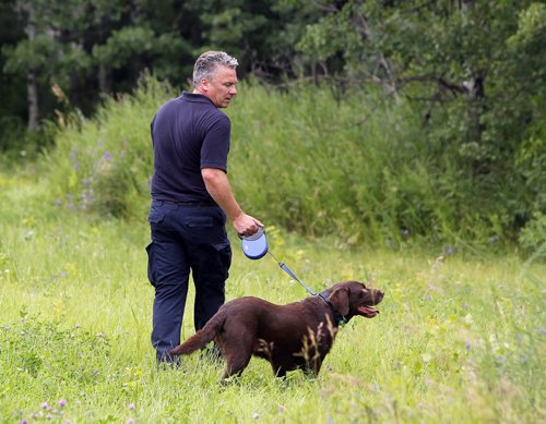 Police dogs scour the area around Kimberly and London in search for missing woman Thelma Krull. BORIS MINKEVICH/WINNIPEG FREE PRESS July 14, 2015