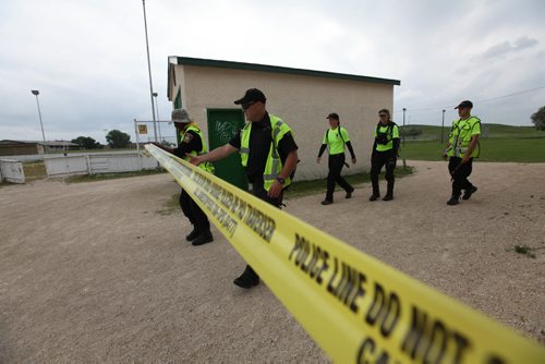Officers search the area around Kimberly hill and Valley Gardens CC for clues  to the whereabouts of the missing women, Thelma Krull Tuesday.  July 14,, 2015 Ruth Bonneville / Winnipeg Free Press