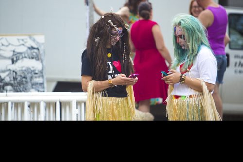 Doris Essenburg (left) and Chloe Poirier, headhunters in Mulligan's Island, text before the Winnipeg Fringe Festival kick-off at the Old Market Square in Winnipeg on Wednesday, July 15, 2015.   Mikaela MacKenzie / Winnipeg Free Press
