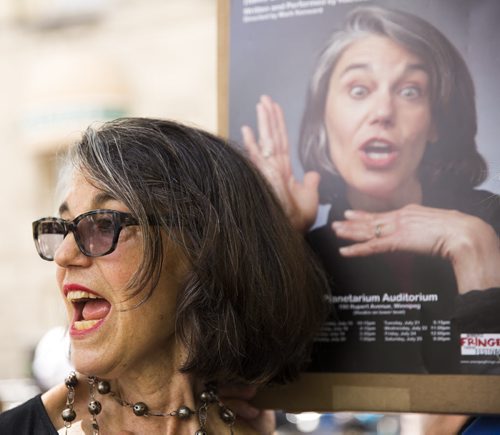 Kathleen Denny promotes her piece at the Winnipeg Fringe Festival kick-off at the Old Market Square in Winnipeg on Wednesday, July 15, 2015.   Mikaela MacKenzie / Winnipeg Free Press