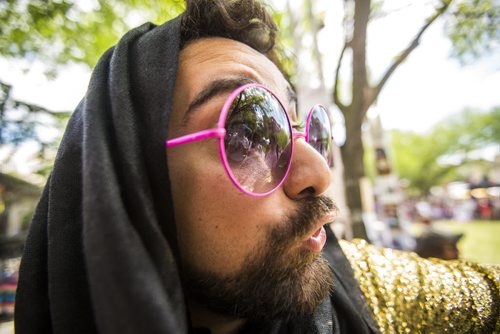 An eclectically-dressed Izad Etemadi promotes his show, Love with Leila, at the Winnipeg Fringe Festival kick-off at the Old Market Square in Winnipeg on Wednesday, July 15, 2015.   Mikaela MacKenzie / Winnipeg Free Press