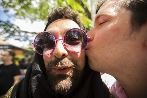 Izad Etemadi (left) and Adam Bailey ham it up for the camera at the Winnipeg Fringe Festival kick-off at the Old Market Square in Winnipeg on Wednesday, July 15, 2015.   Mikaela MacKenzie / Winnipeg Free Press