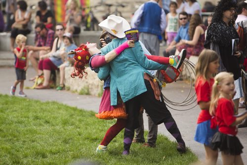 Performers pose for the camera at the Winnipeg Fringe Festival kick-off at the Old Market Square in Winnipeg on Wednesday, July 15, 2015.   Mikaela MacKenzie / Winnipeg Free Press
