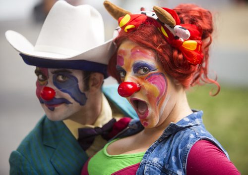 Jed Tomlinson (left) and Jacqueline Russell ham it up for the camera as the Winnipeg Fringe Festival kicks off at the Old Market Square in Winnipeg on Wednesday, July 15, 2015. They perform as Spark and Sizzle in The Sama Kutra.
  Mikaela MacKenzie / Winnipeg Free Press