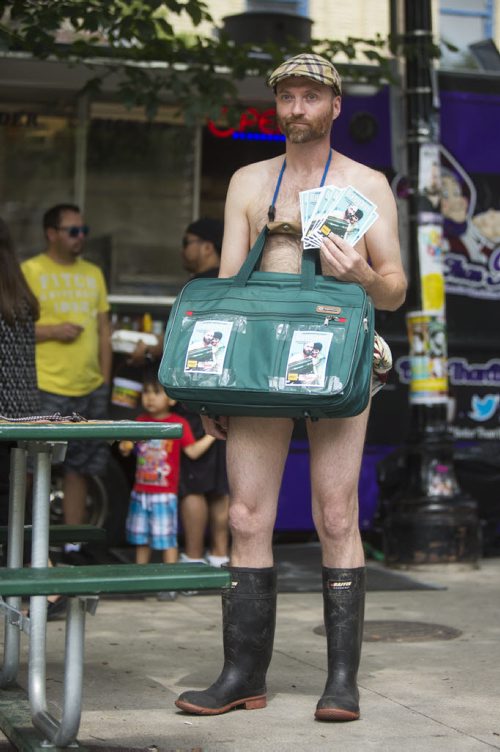 Trevor Campbell promotes his show, Baggage, at the Winnipeg Fringe Festival kick-off at the Old Market Square in Winnipeg on Wednesday, July 15, 2015.   Mikaela MacKenzie / Winnipeg Free Press