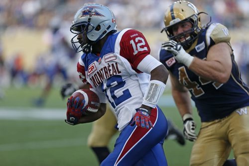 Montreal Alouettes  QB #12 Rakeem Cato runs with the ball  during the first half of the game at the Stadium Saturday.  July 10, 2015 Ruth Bonneville / Winnipeg Free Press