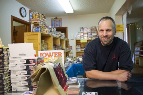 Mike Bergmann, owner of Lower Level Sports Cards and Collectibles, in his sports card shop in Elmwood on Thursday, July 16, 2015.  Mikaela MacKenzie / Winnipeg Free Press