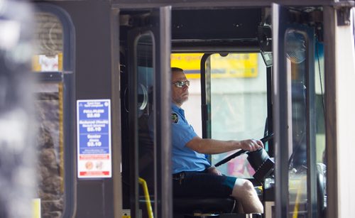 Buses come and go on Portage Avenue in Winnipeg on Thursday, July 16, 2015.  As some buses don't have air conditioning, many are complaining of the heat. Mikaela MacKenzie / Winnipeg Free Press