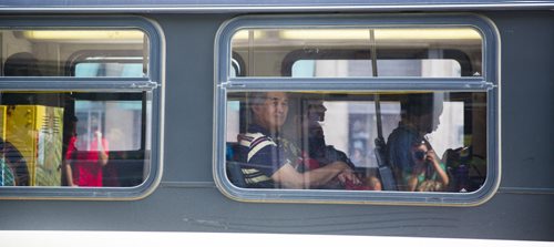 Passengers ride a bus on Portage Avenue in Winnipeg on Thursday, July 16, 2015.  As some buses don't have air conditioning, many are complaining of the heat. Mikaela MacKenzie / Winnipeg Free Press