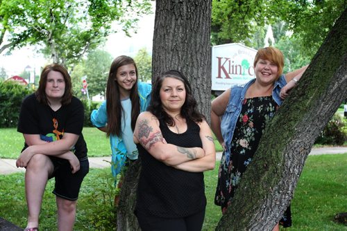 Volunteer Column; Volunteers with Klinic pose for a portrait outside their building on Broadway.  Names from left - Melody Pendree (Peer Supporter), Michelle Paluszek (Peer Supporter), Gillian Roy (Youth Health Educator) and Erica McNabb (Youth Health Educator).  July 16,, 2015 Ruth Bonneville / Winnipeg Free Press