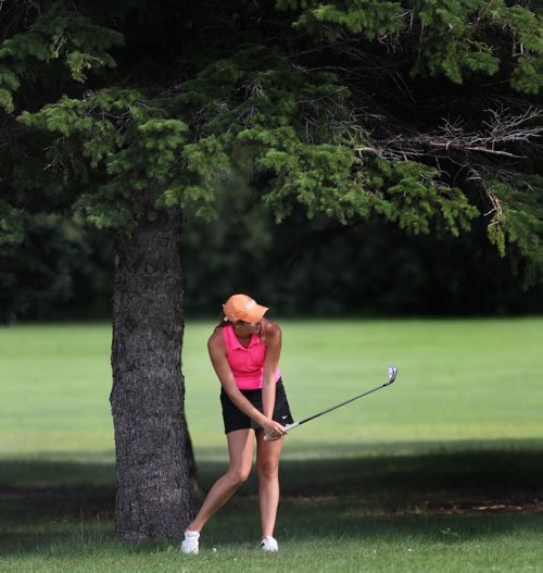 Veronica Vetesnik looks for the green from the rough on the 17th at Elmhurst Thursday afternoon on her way to winning the Women's Junior Championship. See Tim Campbell's story. July 16, 2015 - (Phil Hossack / Winnipeg Free Press)