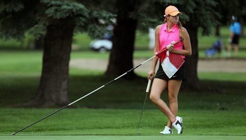 Veronica Vetesnik holds the pin while her closest competitors putt on the 17th at Elmhurst Thursday afternoon on her way to winning the Women's Junior Championship. See Tim Campbell's story. July 16, 2015 - (Phil Hossack / Winnipeg Free Press)