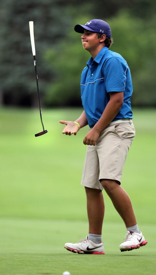 Marco Trstenjak tosses his putter after rimming the cup in one of several putts on the 18th tee at Elmhurst CC. Wesley Hoydalo took the lead and kept it from the 17th green in the Men's Junior Championship. See Tim Campbell's story. July 16, 2015 - (Phil Hossack / Winnipeg Free Press)