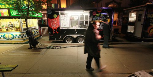 A well lit patron at Food truck row on King Street at Market Square Fringe Festival party THursday evening. See Bart's story. July 16, 2015 - (Phil Hossack / Winnipeg Free Press)