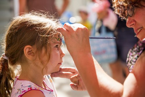 Anouchka De Lazzer gets her face painted by Ginny Sudlow at the Fringe Festival at Old Market Square in Winnipeg on Friday, July 17, 2015.   Mikaela MacKenzie / Winnipeg Free Press