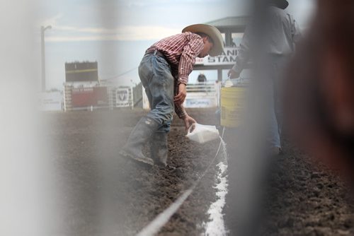 Jeff Neufeld chalks up the finish line just before the races start at the   52nd annual Morris Stampede Friday afternoon.   July 17,, 2015 Ruth Bonneville / Winnipeg Free Press