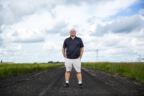 Al Small, Free Press entertainment editor, stands on a country road just outside of Winnipeg on Saturday, July 18, 2015.   Mikaela MacKenzie / Winnipeg Free Press