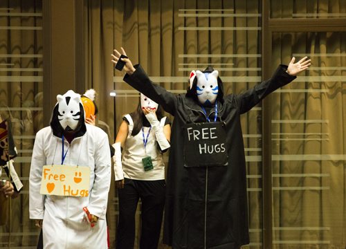 People offer free hugs at Ai-Kon at the RBC Convention Centre in Winnipeg on Saturday, July 18, 2015.   Mikaela MacKenzie / Winnipeg Free Press