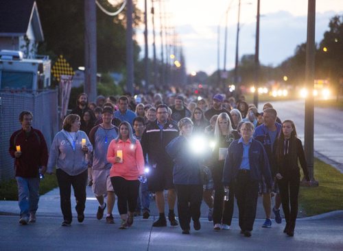 Family, friends, and residents of the community come together for a walk to "light the way" for Thelma on Concordia Avenue in Winnipeg on Saturday, July 18, 2015.   Mikaela MacKenzie / Winnipeg Free Press