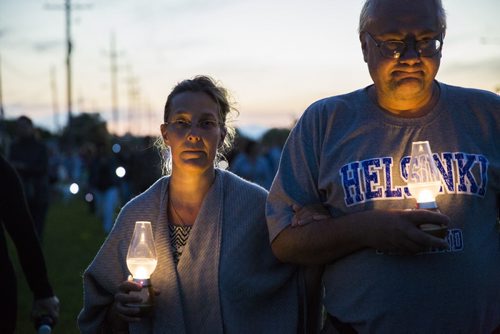 Mary and Ron Scrapneck walk to "light the way" for Thelma on Concordia Avenue in Winnipeg on Saturday, July 18, 2015.   Mikaela MacKenzie / Winnipeg Free Press