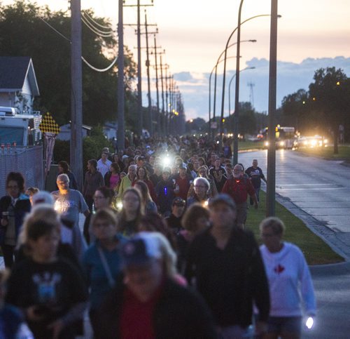 Family, friends, and residents of the community come together for a walk to "light the way" for Thelma on Concordia Avenue in Winnipeg on Saturday, July 18, 2015.   Mikaela MacKenzie / Winnipeg Free Press