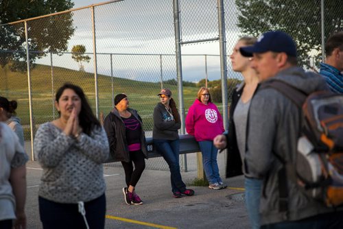 Family, friends, and residents of the community gather for a walk to "light the way" for Thelma on Concordia Avenue in Winnipeg on Saturday, July 18, 2015.   Mikaela MacKenzie / Winnipeg Free Press