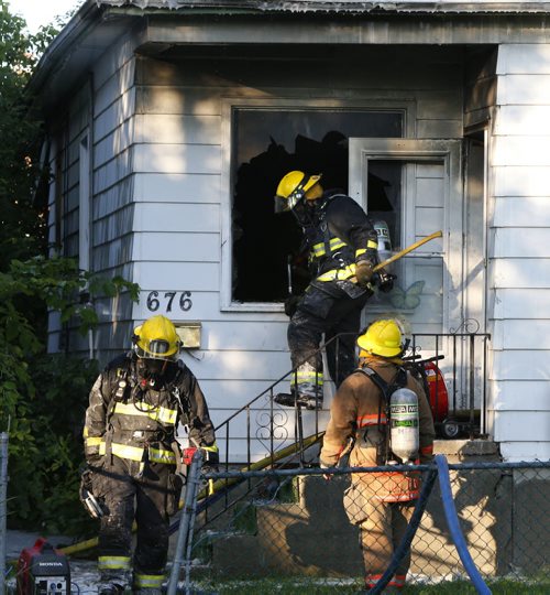 Fire Fighters at the scene of a one and a half storey house fire in the 600 block of Pritchard Ave. near McKenzie St. that caused extensive damage Monday morning. Winnipeg Police called in the fire at 5:41AM and when the Fire Dept. arrived no one was in the house. No injuries. Wayne Glowacki / Winnipeg Free Press July 20 2015 ¤